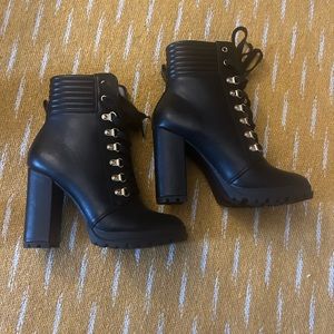 Black wide heel boots.